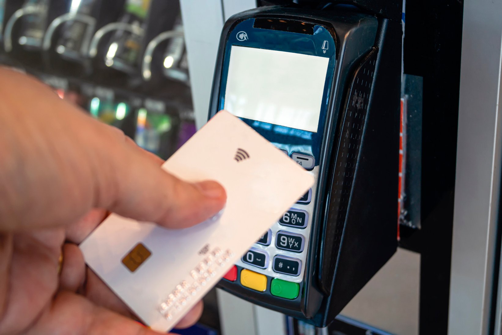 Using credit card on a vending machine. Contactless payment.